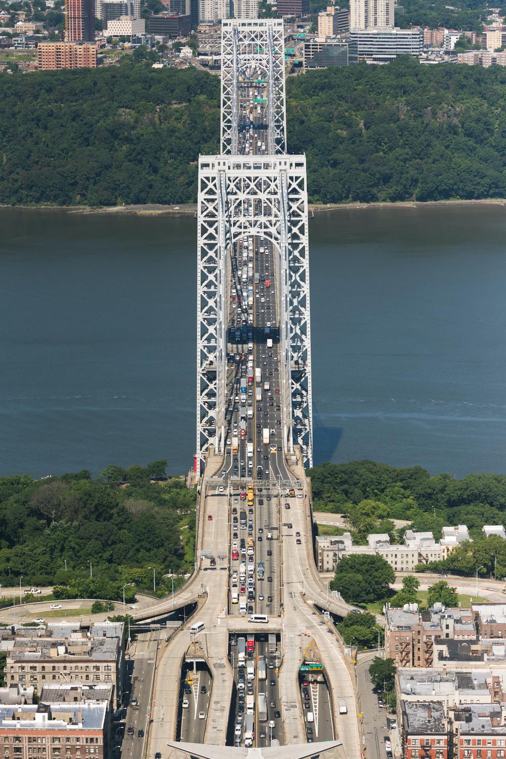 The George Washington bridge, over the Hudson river, from a directly aligned angle looking along the length of the bridge, from the Manhattan side.
